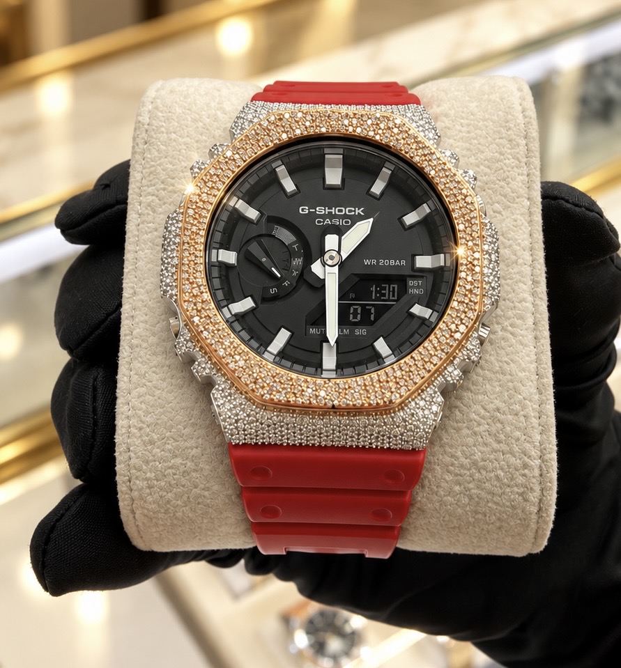 Diamond-set watch with a red strap held naturally after custom setting and service